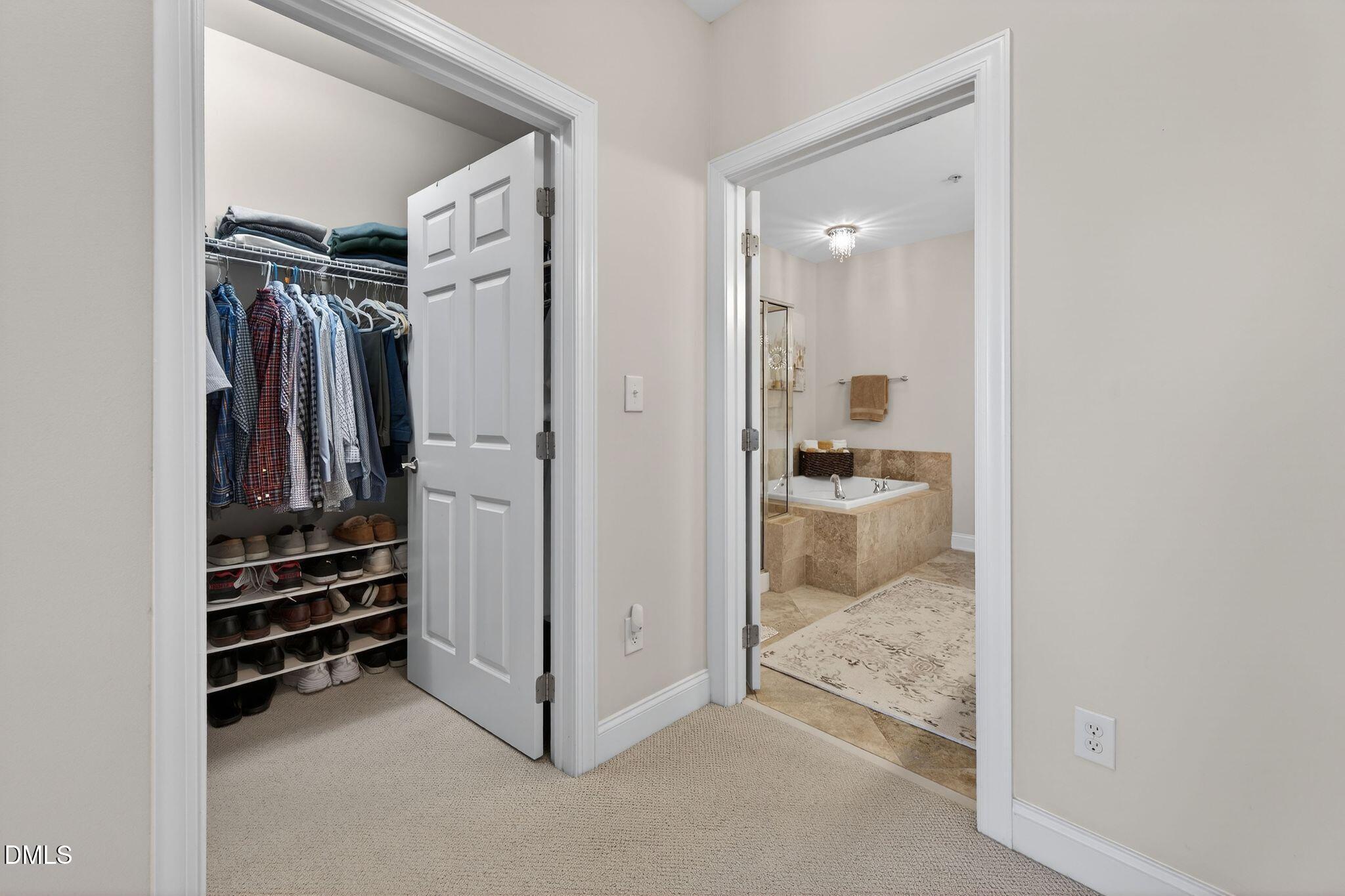 10511 Rosegate Court, Unit 305 Raleigh, NC 27617 - Photo 31 of 48 a view of walk in closet with clothes and shoes