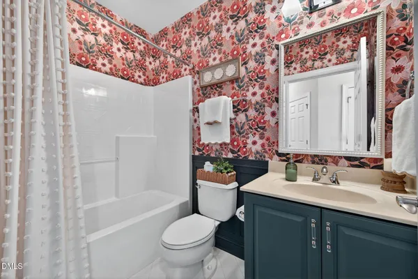 an aerial view of a house with swimming pool and ocean view