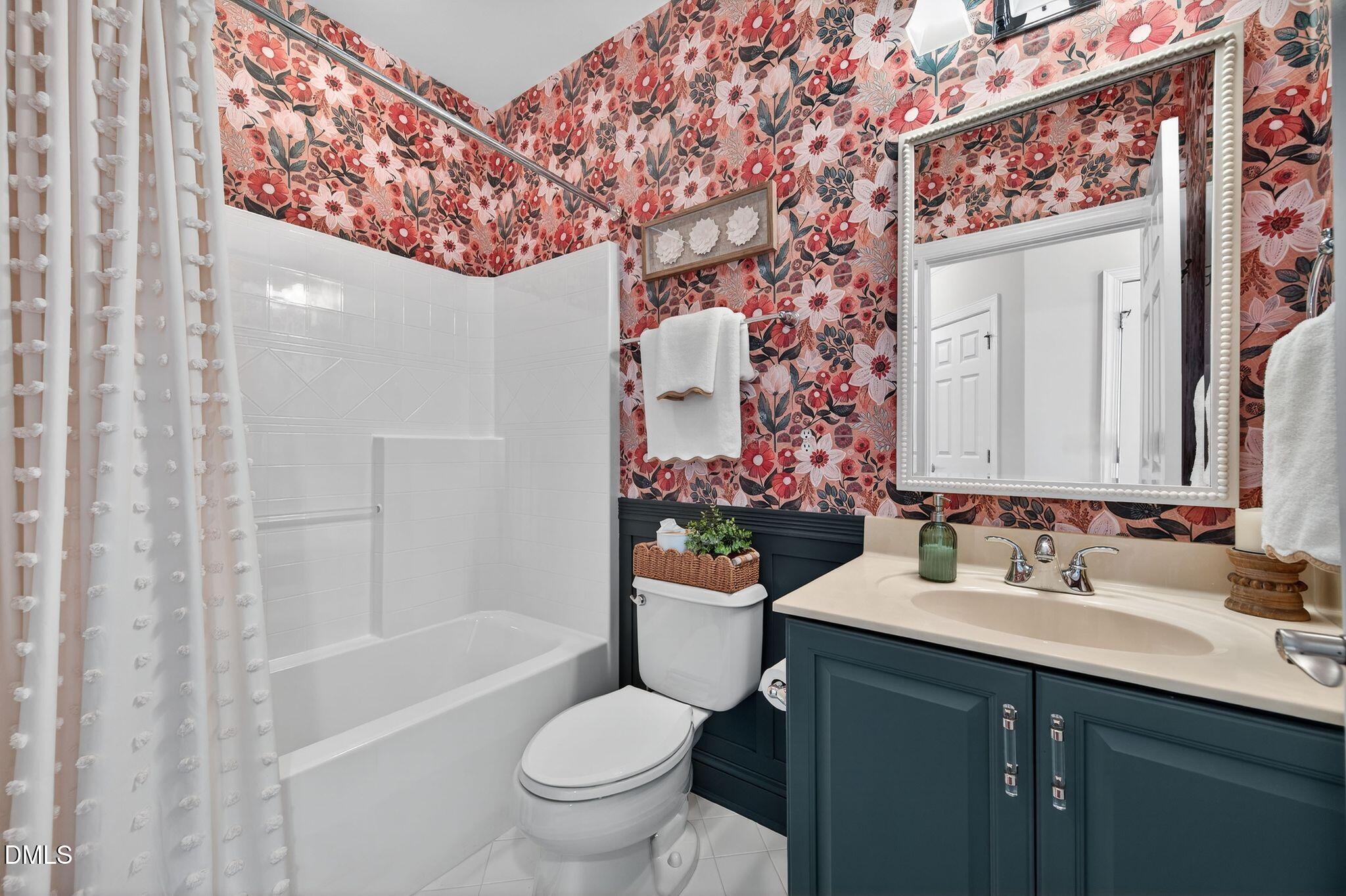 10511 Rosegate Court, Unit 305 Raleigh, NC 27617 - Photo 39 of 48 a bathroom with a sink toilet and shower