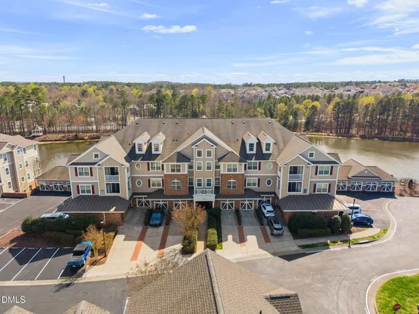 an aerial view of a house with lake view