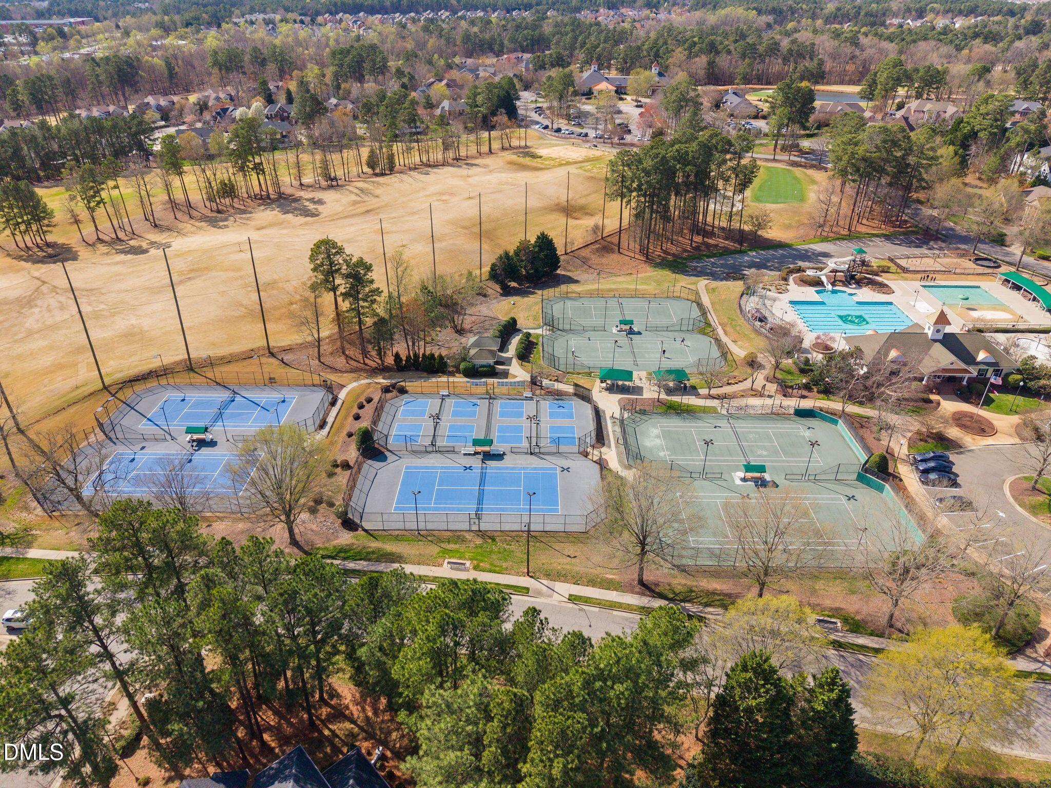 10511 Rosegate Court, Unit 305 Raleigh, NC 27617 - Photo 46 of 48 an aerial view of a houses with a lake view
