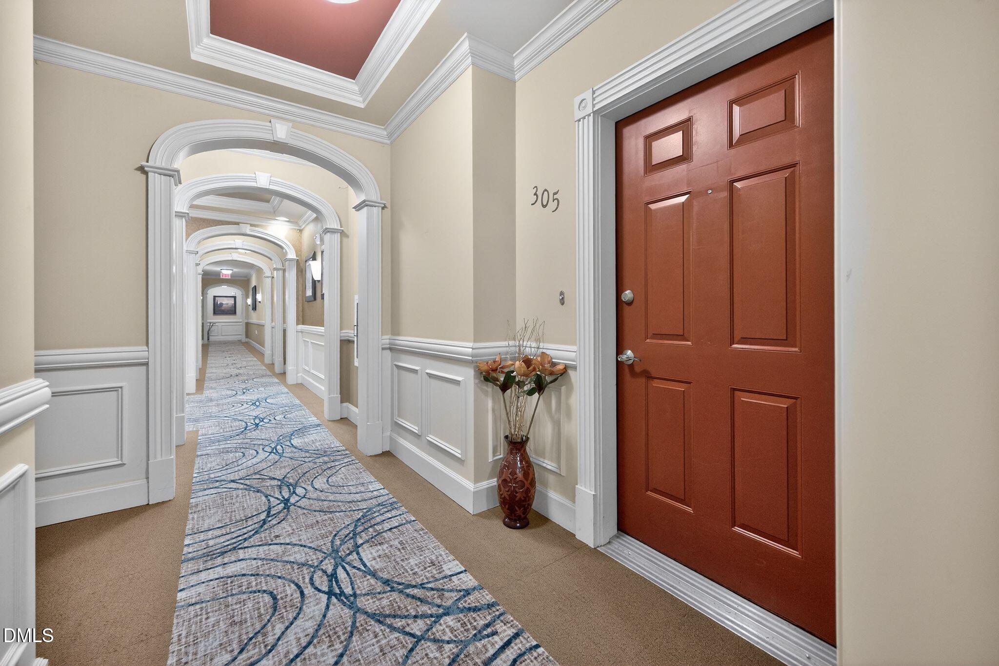 10511 Rosegate Court, Unit 305 Raleigh, NC 27617 - Photo 8 of 48 a view of a hallway with a furniture