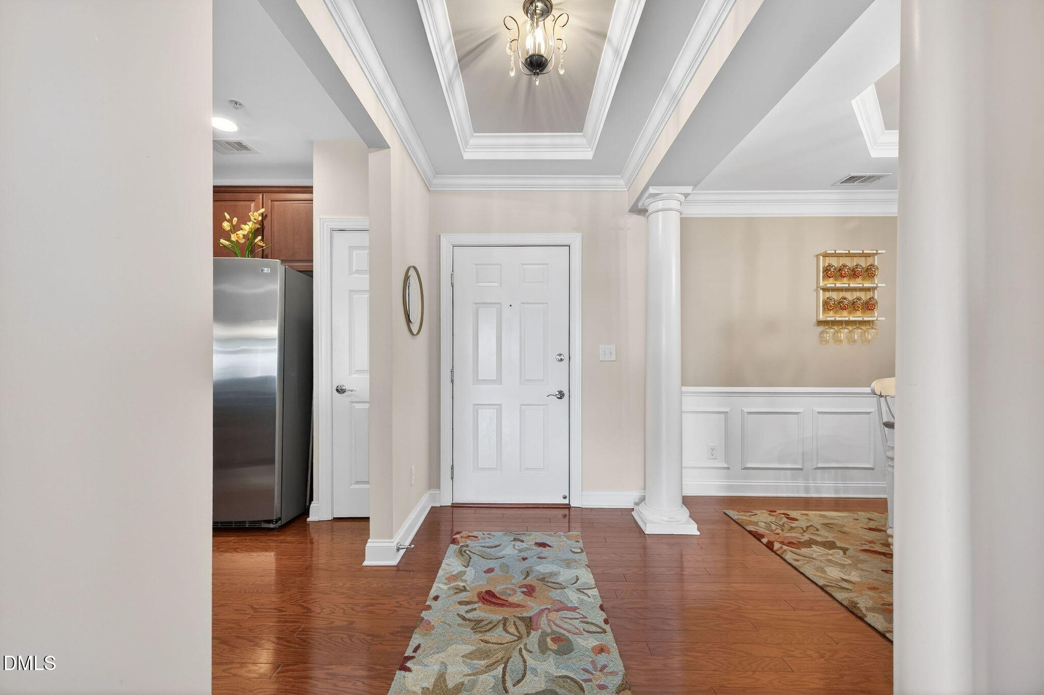10511 Rosegate Court, Unit 305 Raleigh, NC 27617 - Photo 9 of 48 a view of hallway with livingroom and wooden floor