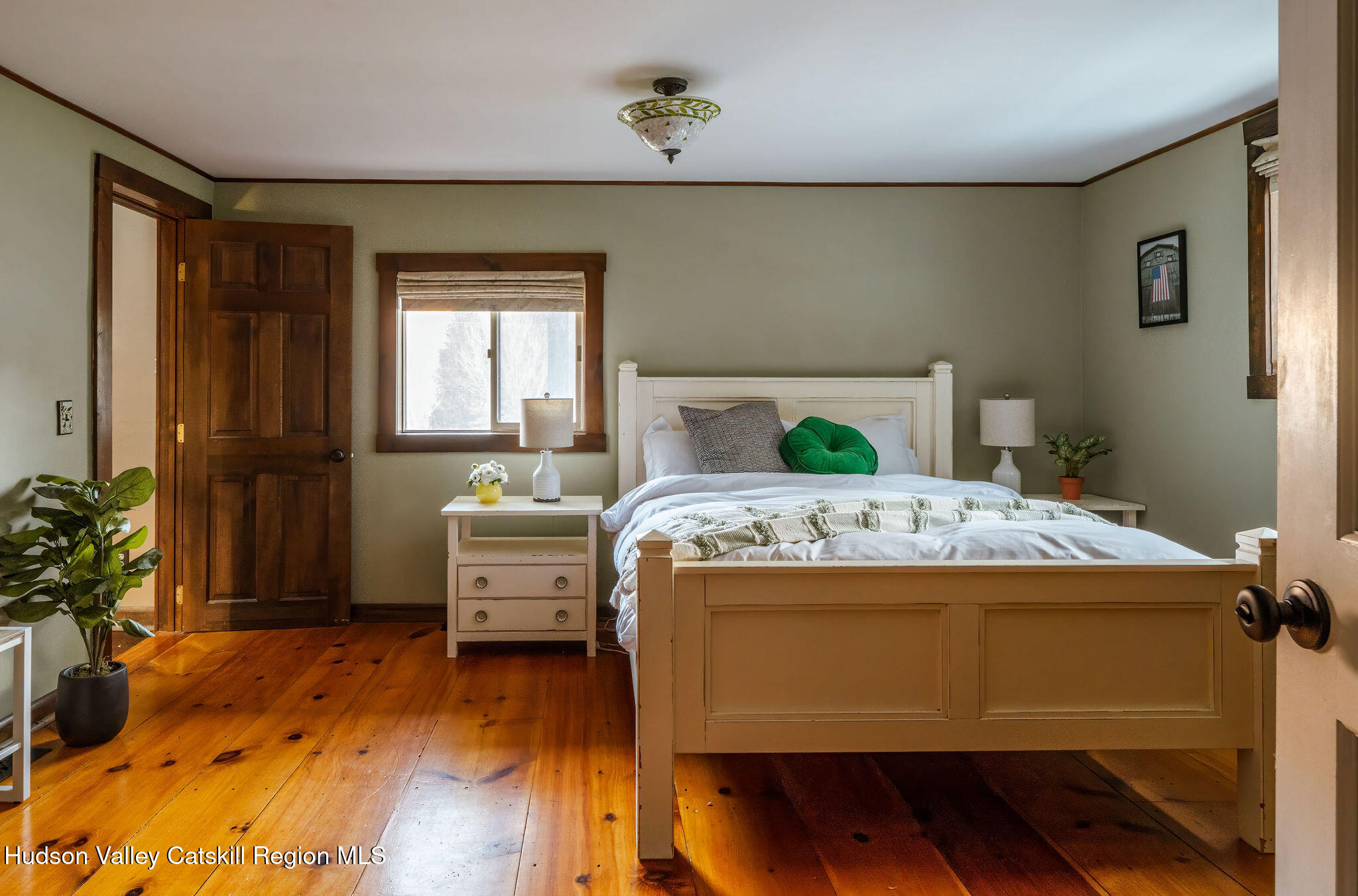 6841 County Highway Denver, NY 12421 - Photo 27 of 36 a bedroom with a bed and wooden floor