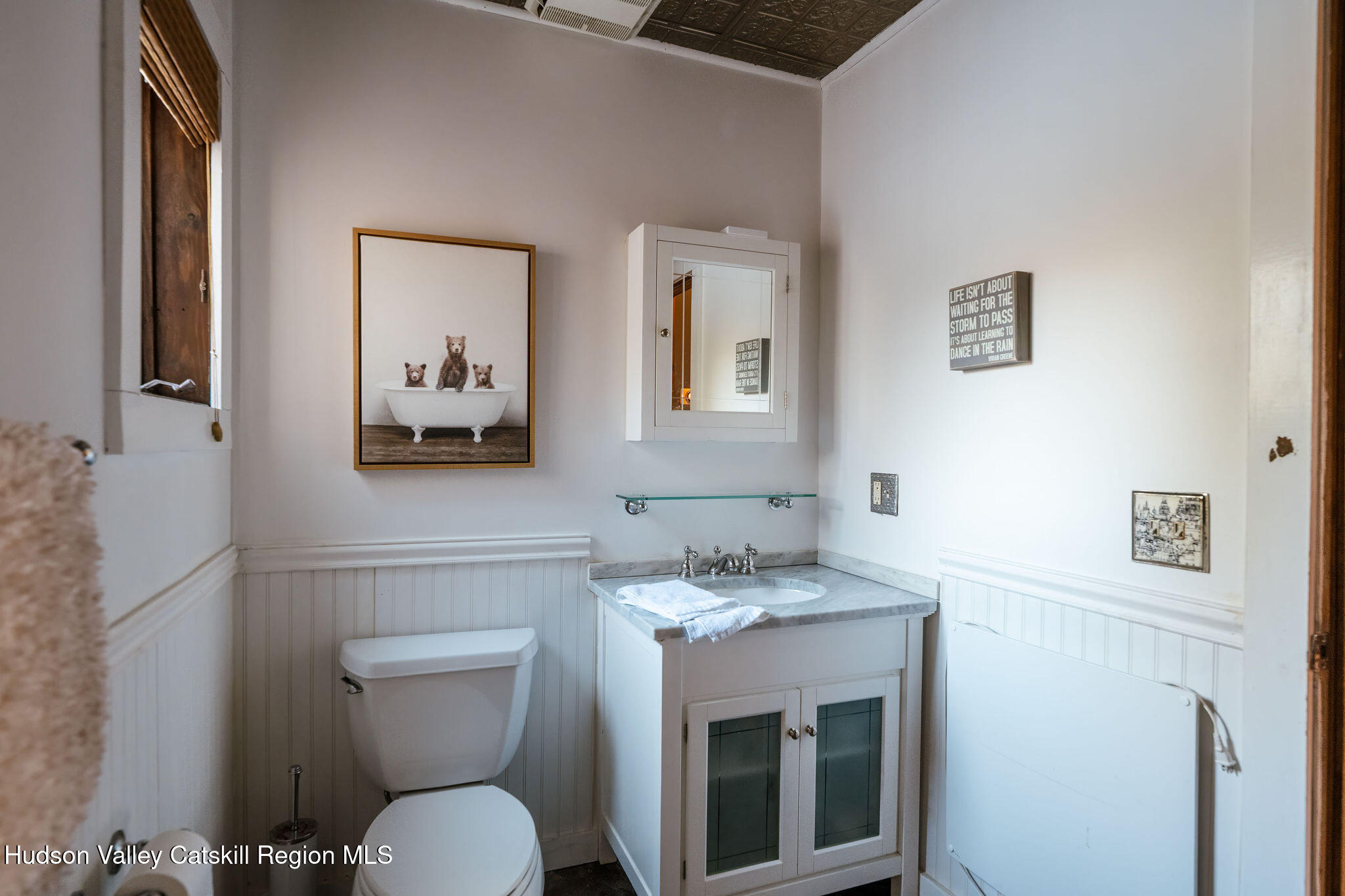 6841 County Highway Denver, NY 12421 - Photo 31 of 36 a bathroom with a toilet a sink and mirror