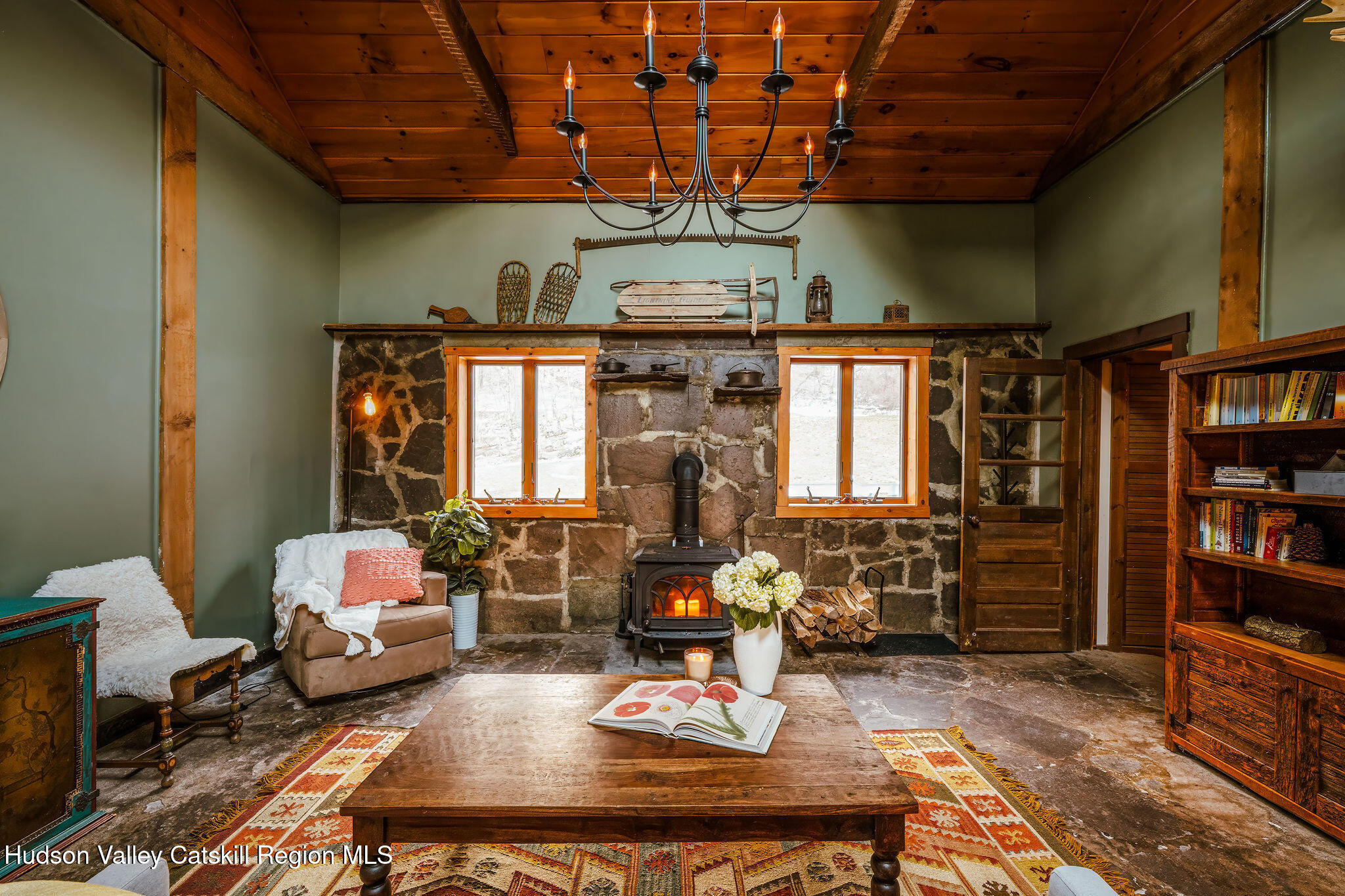 6841 County Highway Denver, NY 12421 - Photo 8 of 36 a living room with furniture a bookshelf and a window