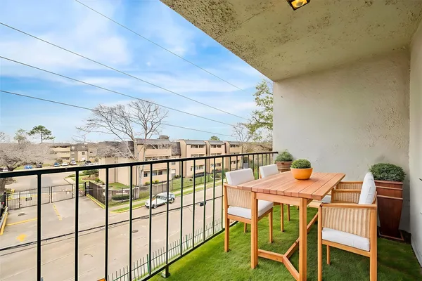 a view of a balcony dining area