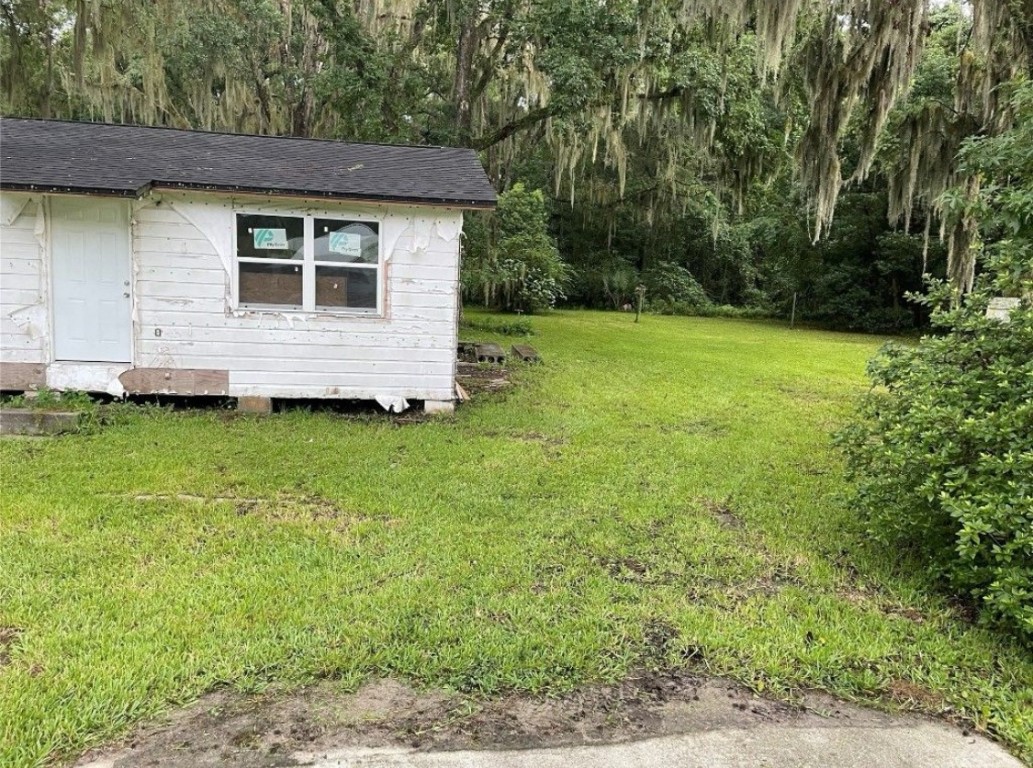 510 Starratt Road Jacksonville, FL 32218 - Photo 2 of 5 a view of a backyard with a garden