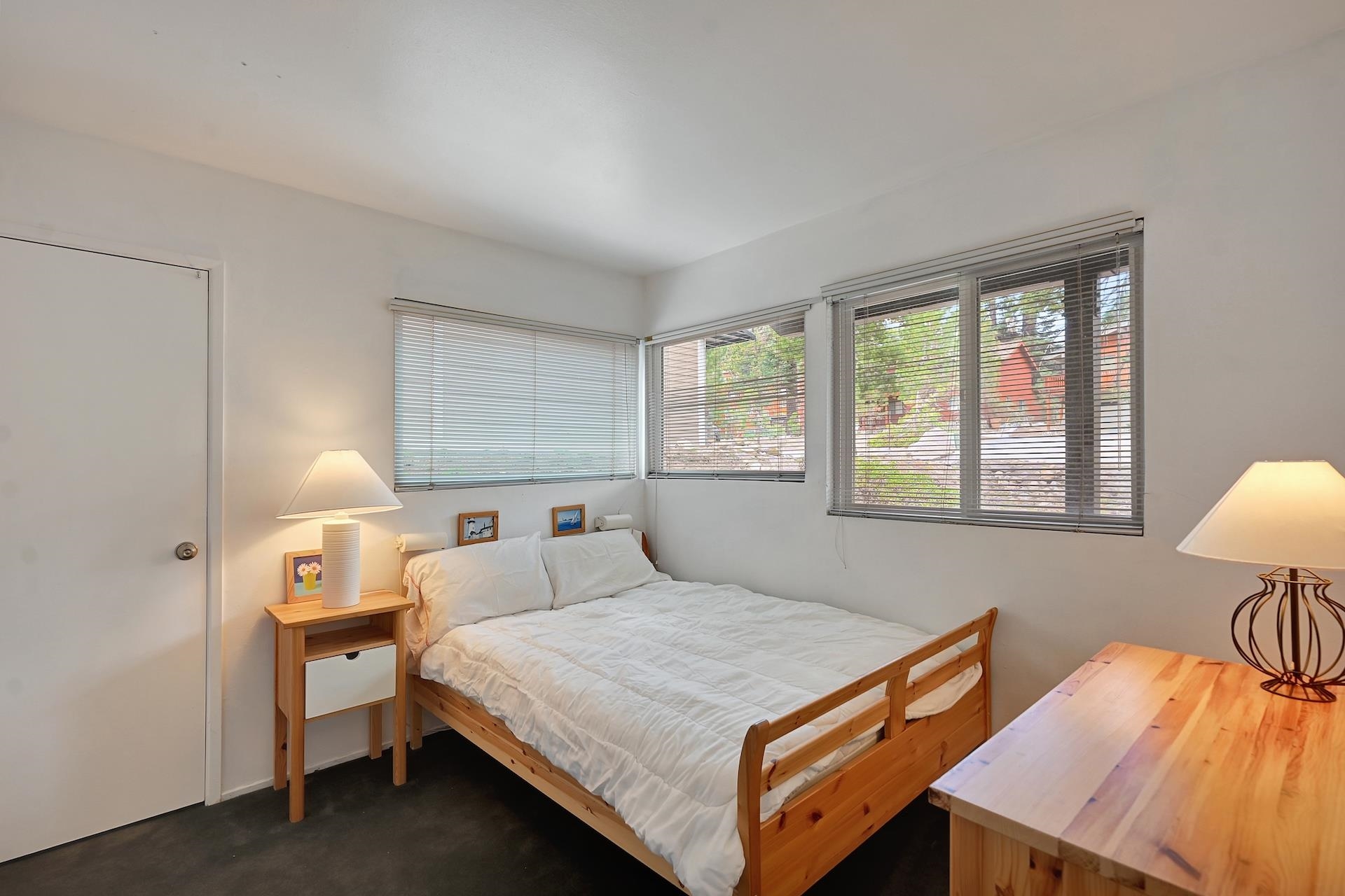 2 Snowridge Lane Mammoth Lakes, CA 93546 - Photo 11 of 25 a bedroom with a bed and a lamp on table