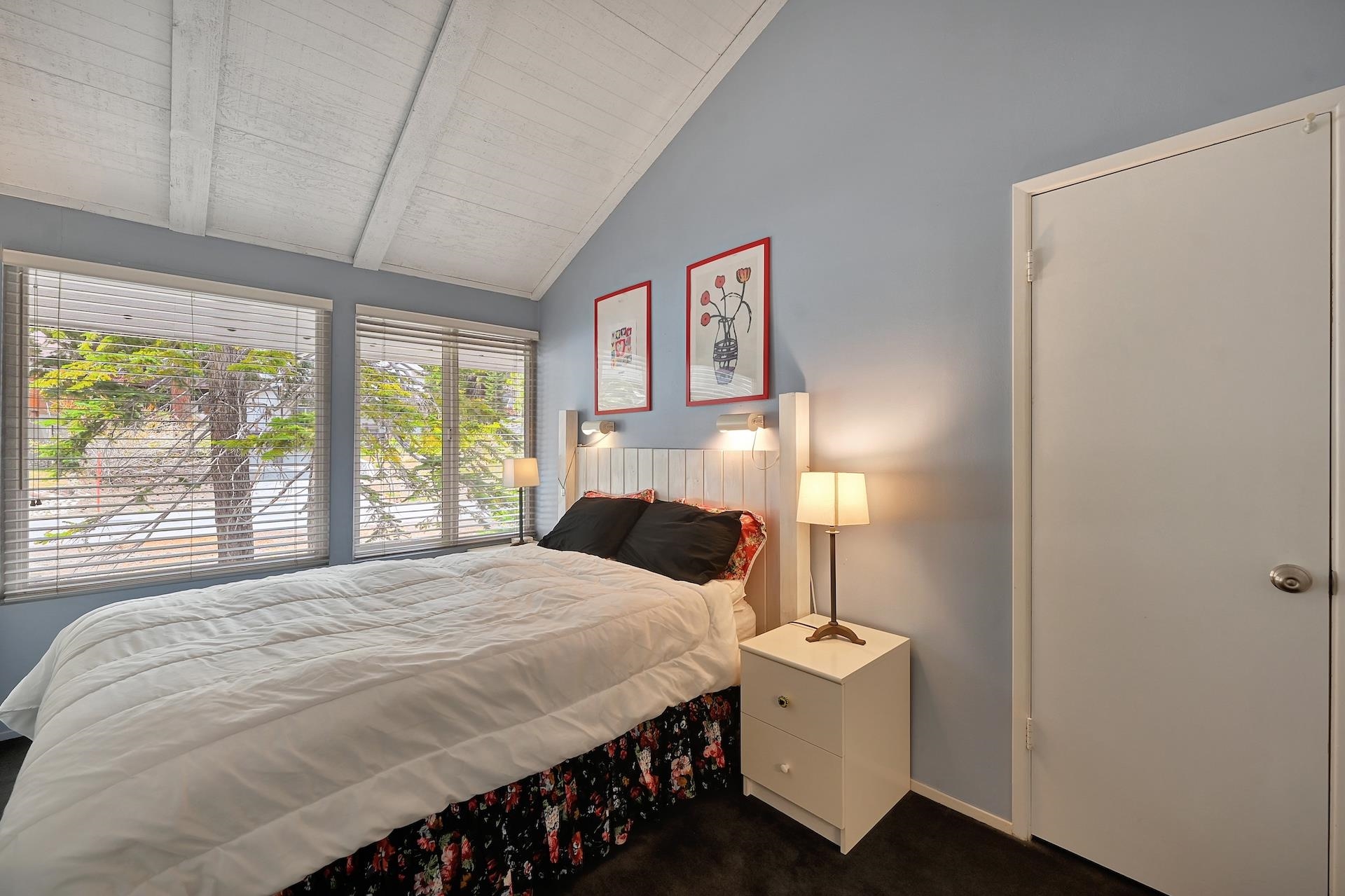 2 Snowridge Lane Mammoth Lakes, CA 93546 - Photo 20 of 25 a bedroom with a bed and a large window with outer view