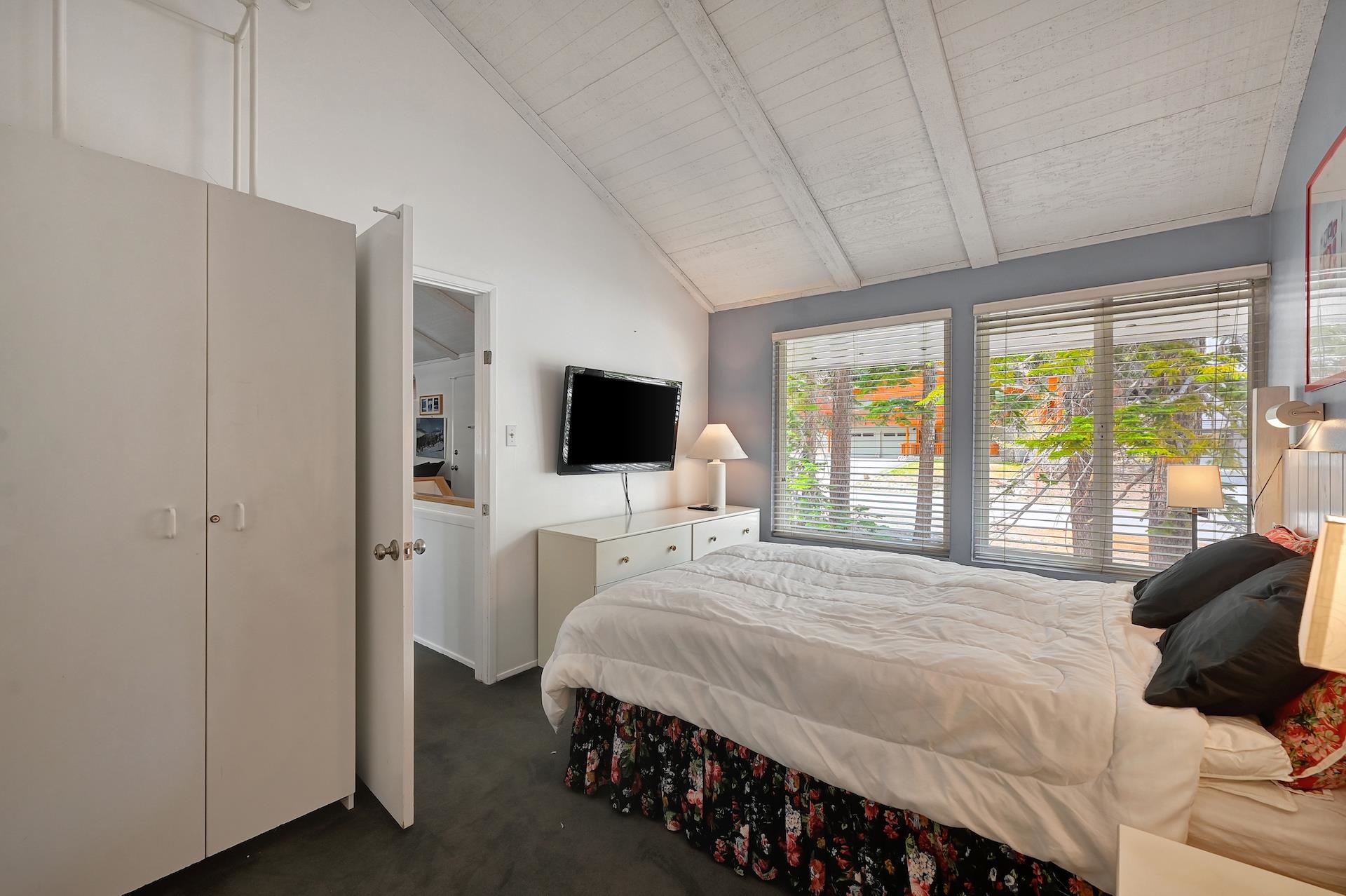 2 Snowridge Lane Mammoth Lakes, CA 93546 - Photo 21 of 25 a bedroom with a bed and a flat screen tv