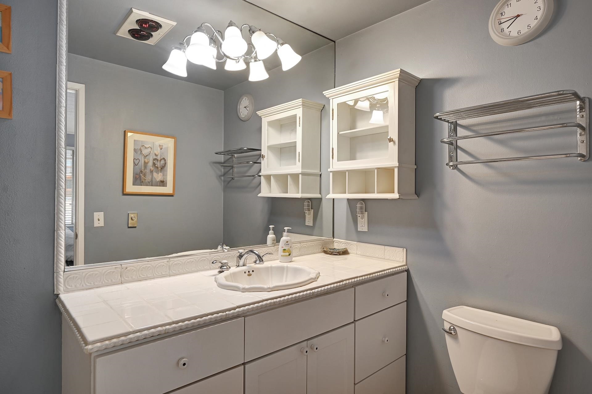 2 Snowridge Lane Mammoth Lakes, CA 93546 - Photo 22 of 25 a bathroom with a sink a mirror and a toilet