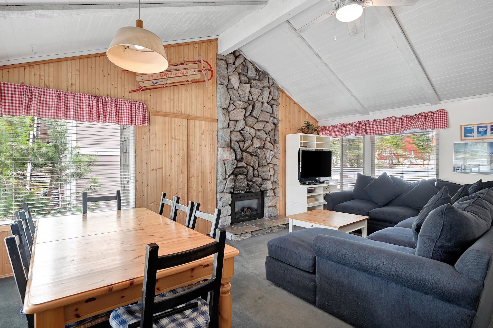 2 Snowridge Lane Mammoth Lakes, CA 93546 - Photo 5 of 25 a living room with furniture a flat screen tv and a large window