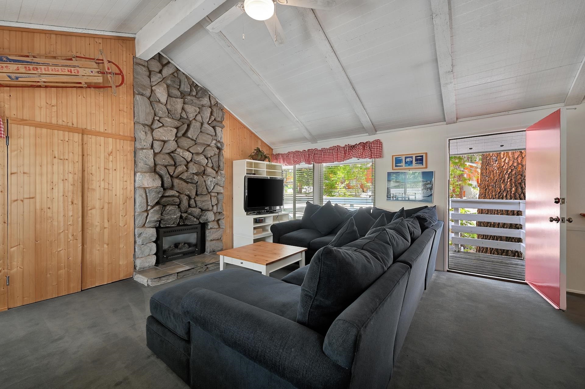 2 Snowridge Lane Mammoth Lakes, CA 93546 - Photo 7 of 25 a living room with furniture a flat screen tv and a window