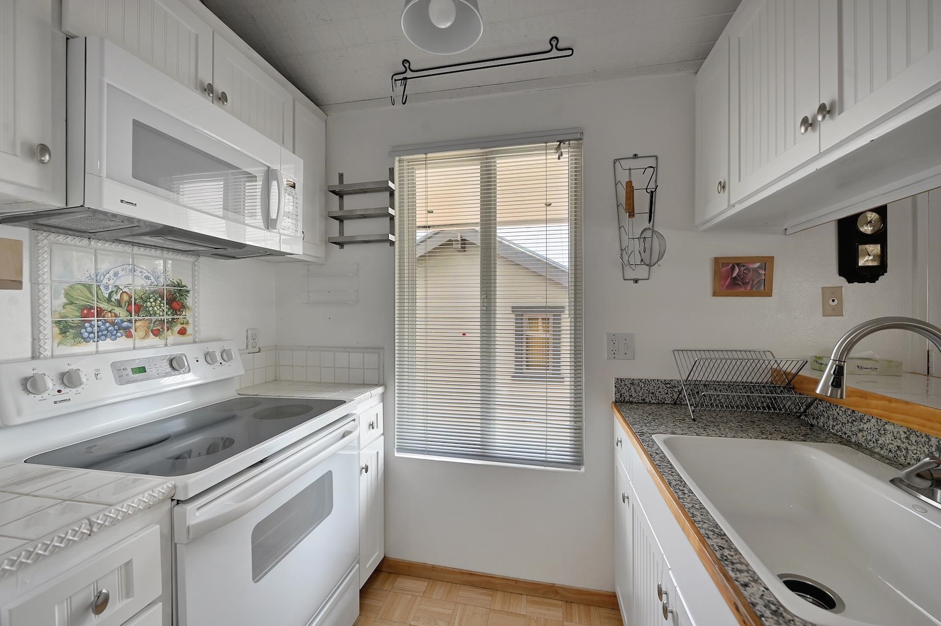 2 Snowridge Lane Mammoth Lakes, CA 93546 - Photo 10 of 25 a kitchen with stainless steel appliances granite countertop a sink stove and cabinets