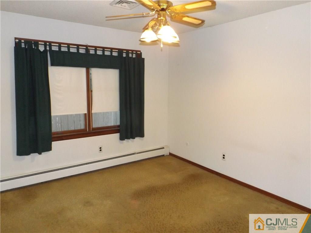 218 Docks Corner Road Dayton, NJ 08810 - Photo 13 of 21 a view of an empty room with a window