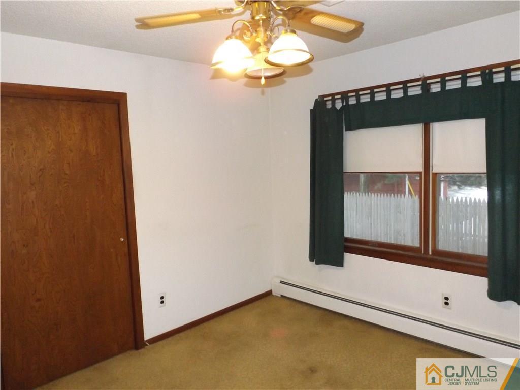 218 Docks Corner Road Dayton, NJ 08810 - Photo 14 of 21 a view of an empty room with a window