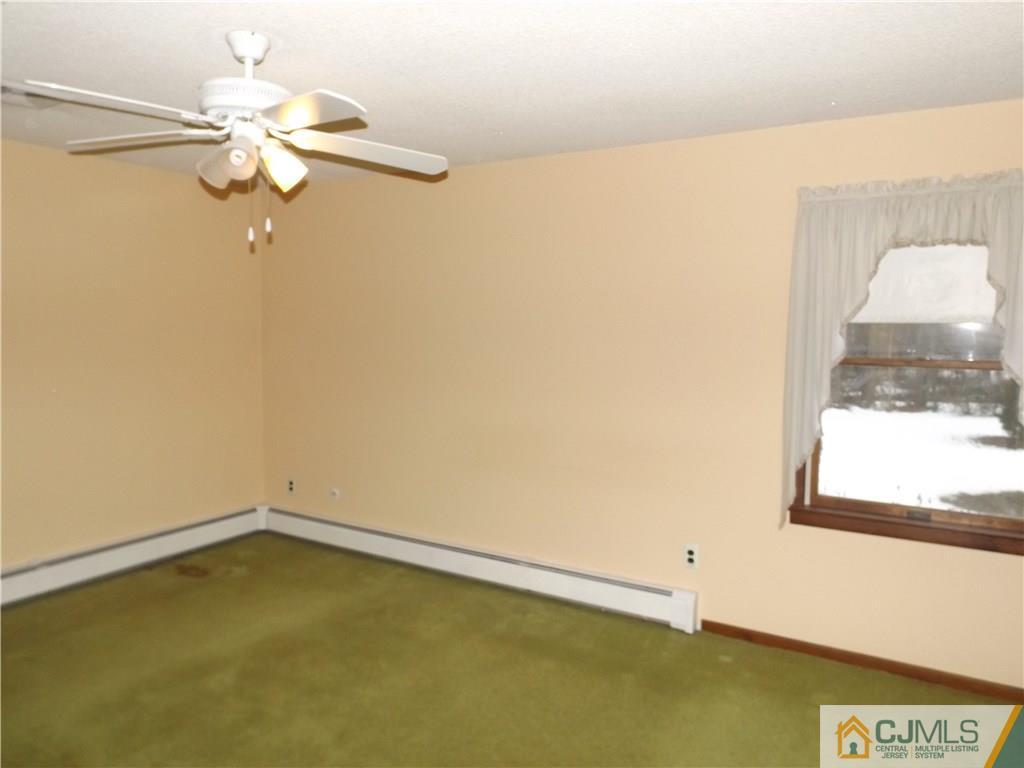 218 Docks Corner Road Dayton, NJ 08810 - Photo 17 of 21 a view of a room with a window and a ceiling fan