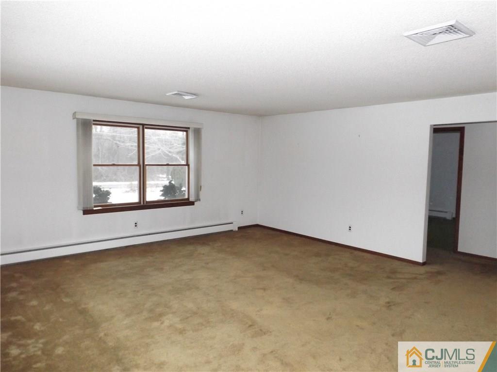 218 Docks Corner Road Dayton, NJ 08810 - Photo 4 of 21 an empty room with windows