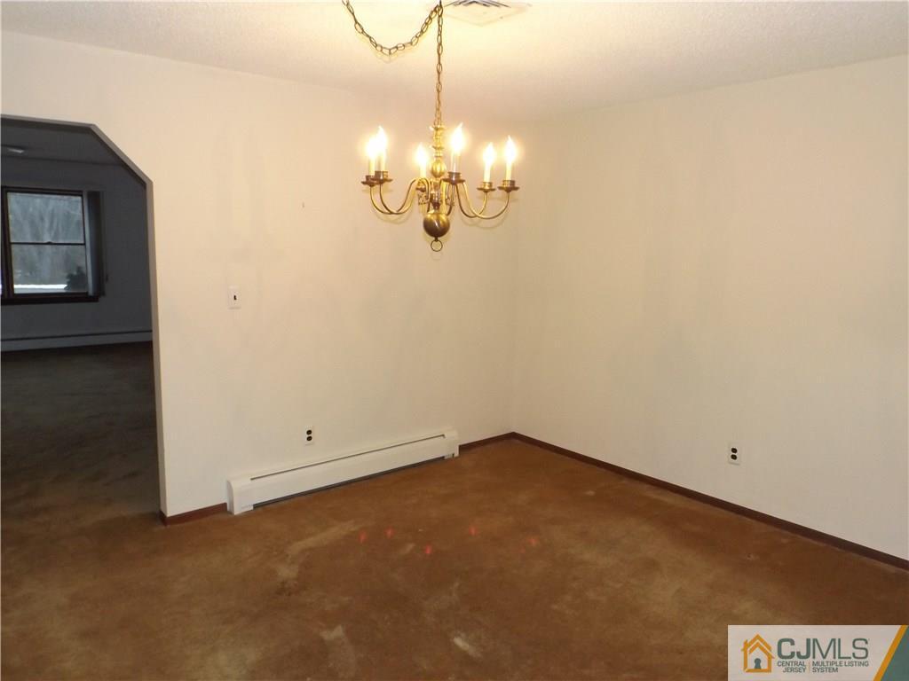 218 Docks Corner Road Dayton, NJ 08810 - Photo 6 of 21 a view of an empty room with chandelier fan