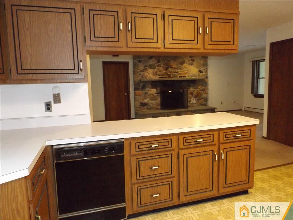 218 Docks Corner Road Dayton, NJ 08810 - Photo 9 of 21 a close view of a sink and a microwave