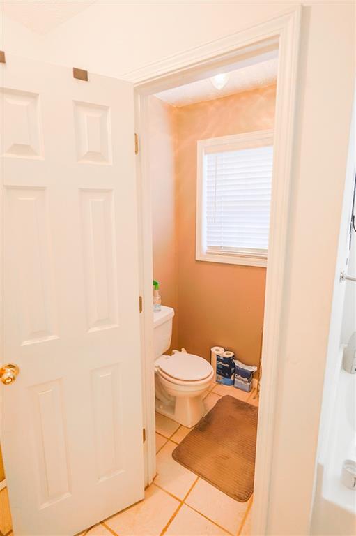 760 Breedlove Road Ball Ground, GA 30107 - Photo 15 of 18 a bathroom with a toilet and a shower