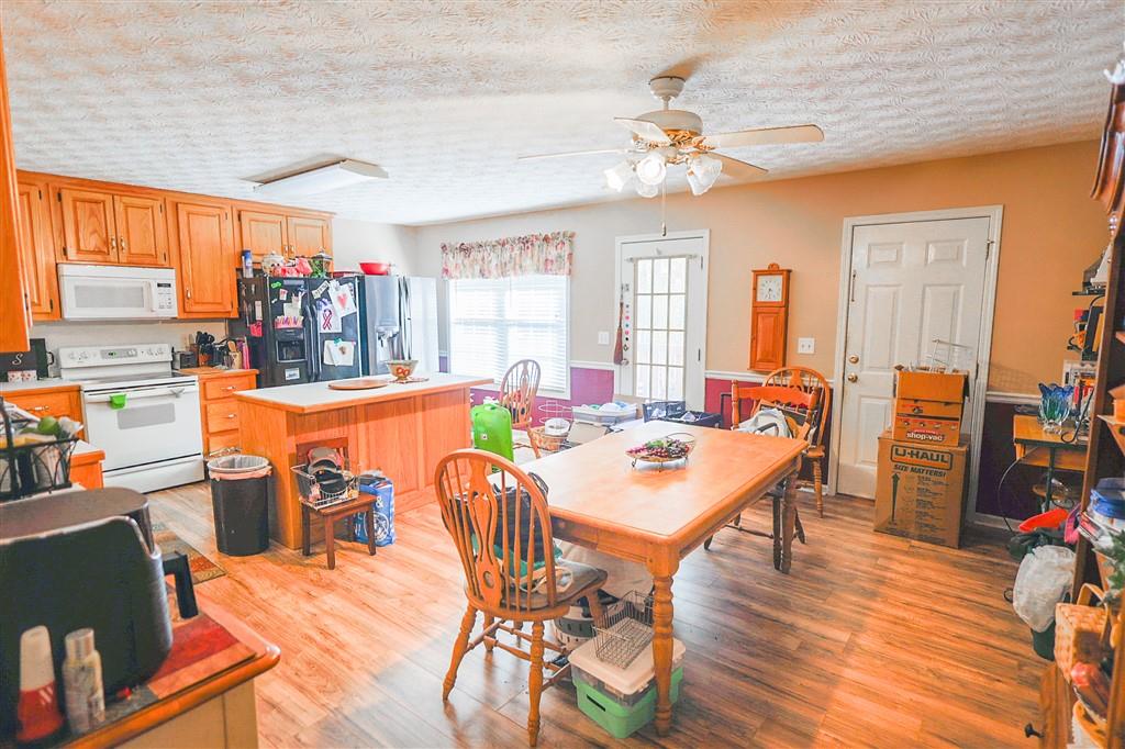 760 Breedlove Road Ball Ground, GA 30107 - Photo 17 of 18 a view of a dining room with furniture window and wooden floor