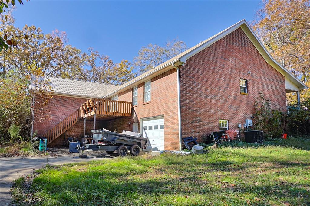 760 Breedlove Road Ball Ground, GA 30107 - Photo 3 of 18 a view of back yard of the house