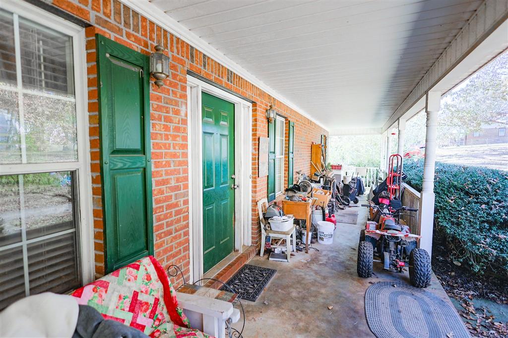 760 Breedlove Road Ball Ground, GA 30107 - Photo 6 of 18 a view of kids room with furniture and floor to ceiling window