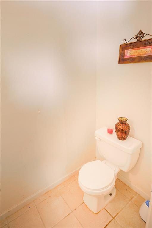 760 Breedlove Road Ball Ground, GA 30107 - Photo 10 of 18 a white toilet sitting next to a white wall
