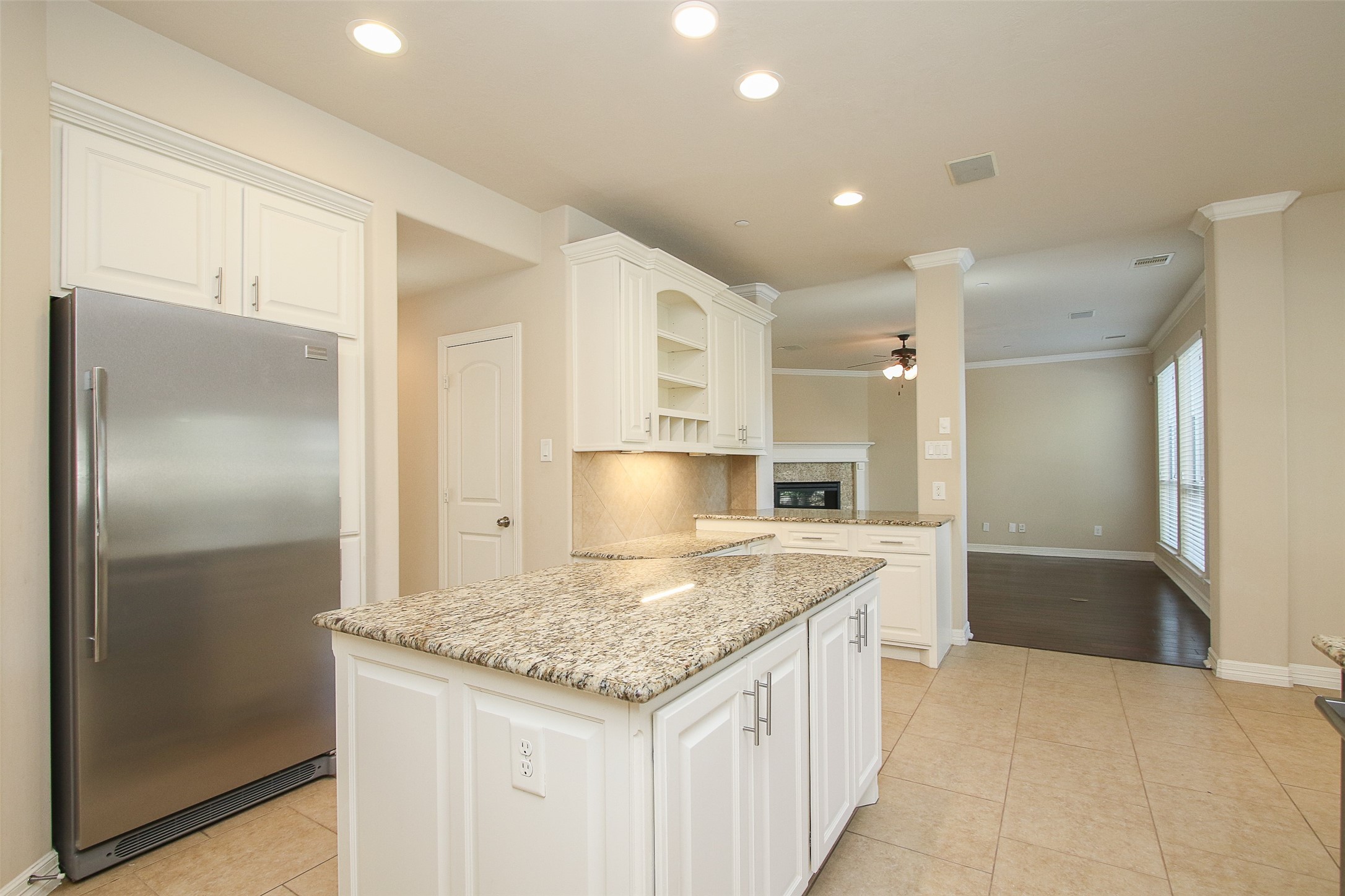 11722 Spriggs Way Houston, TX 77024 - Photo 20 of 49 a kitchen with a refrigerator a sink and a cabinets