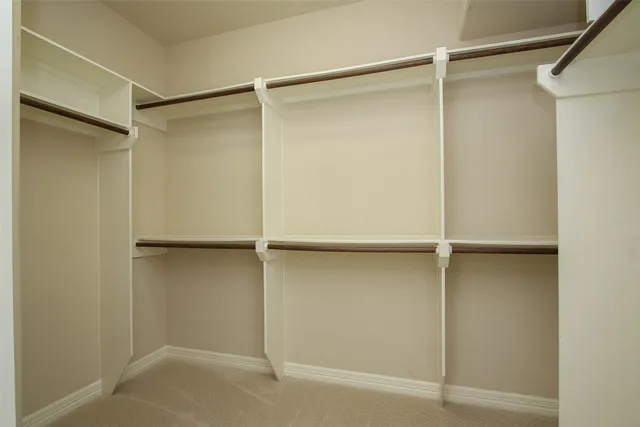 a view of an empty walk in closet