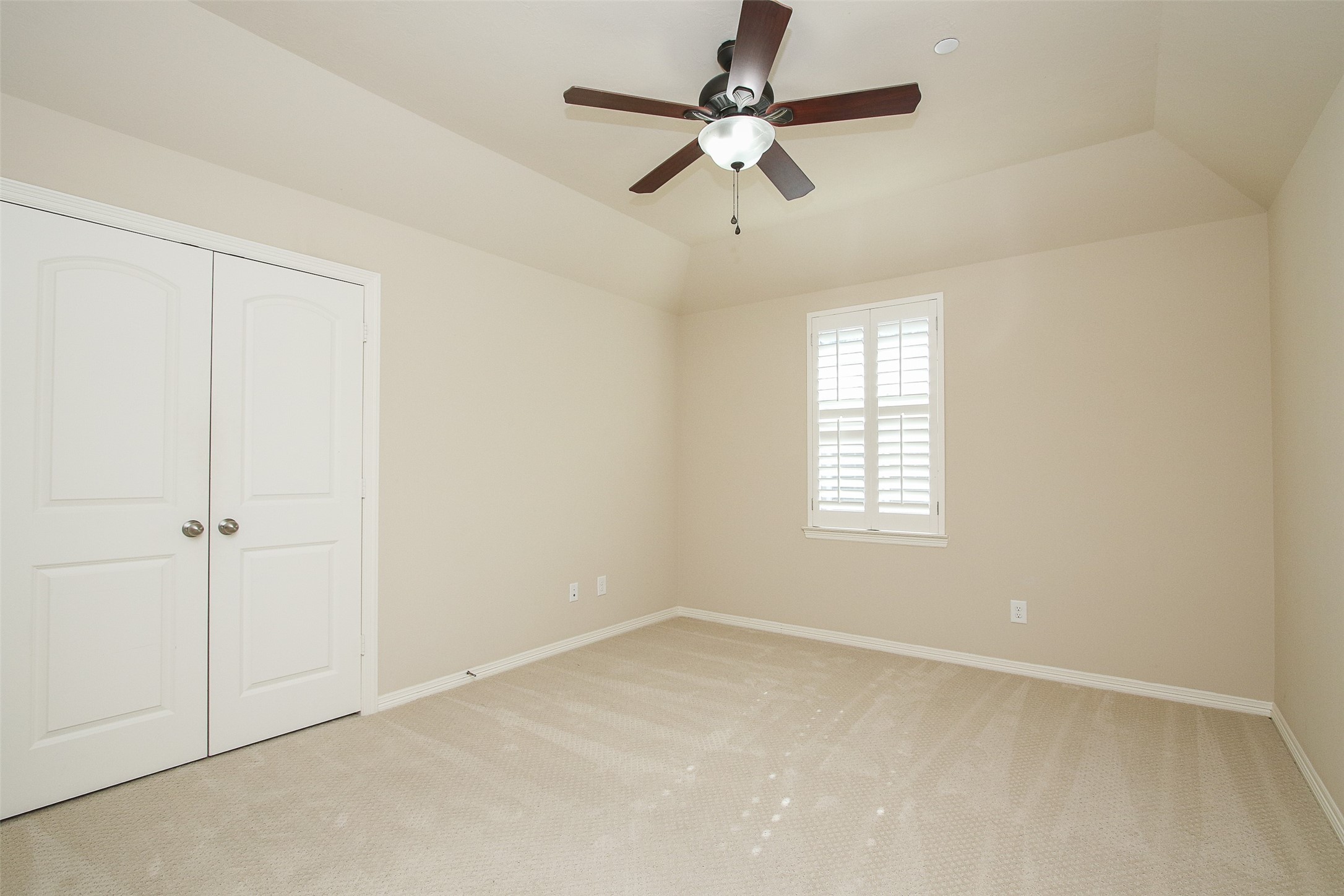 11722 Spriggs Way Houston, TX 77024 - Photo 37 of 49 an empty room with a window and a fan