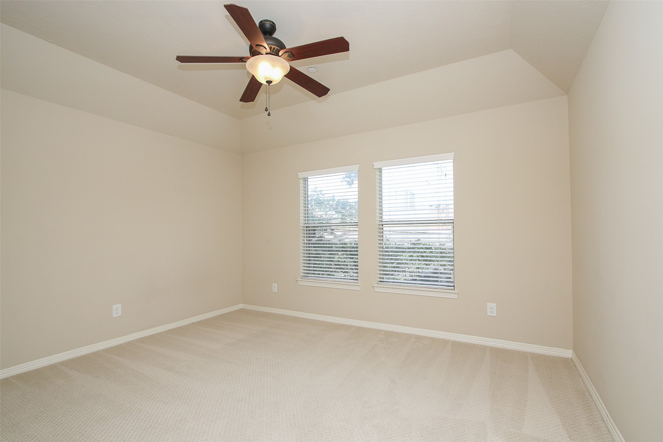 11722 Spriggs Way Houston, TX 77024 - Photo 38 of 49 an empty room with a window and a fan