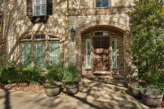 a front view of a house with outdoor seating