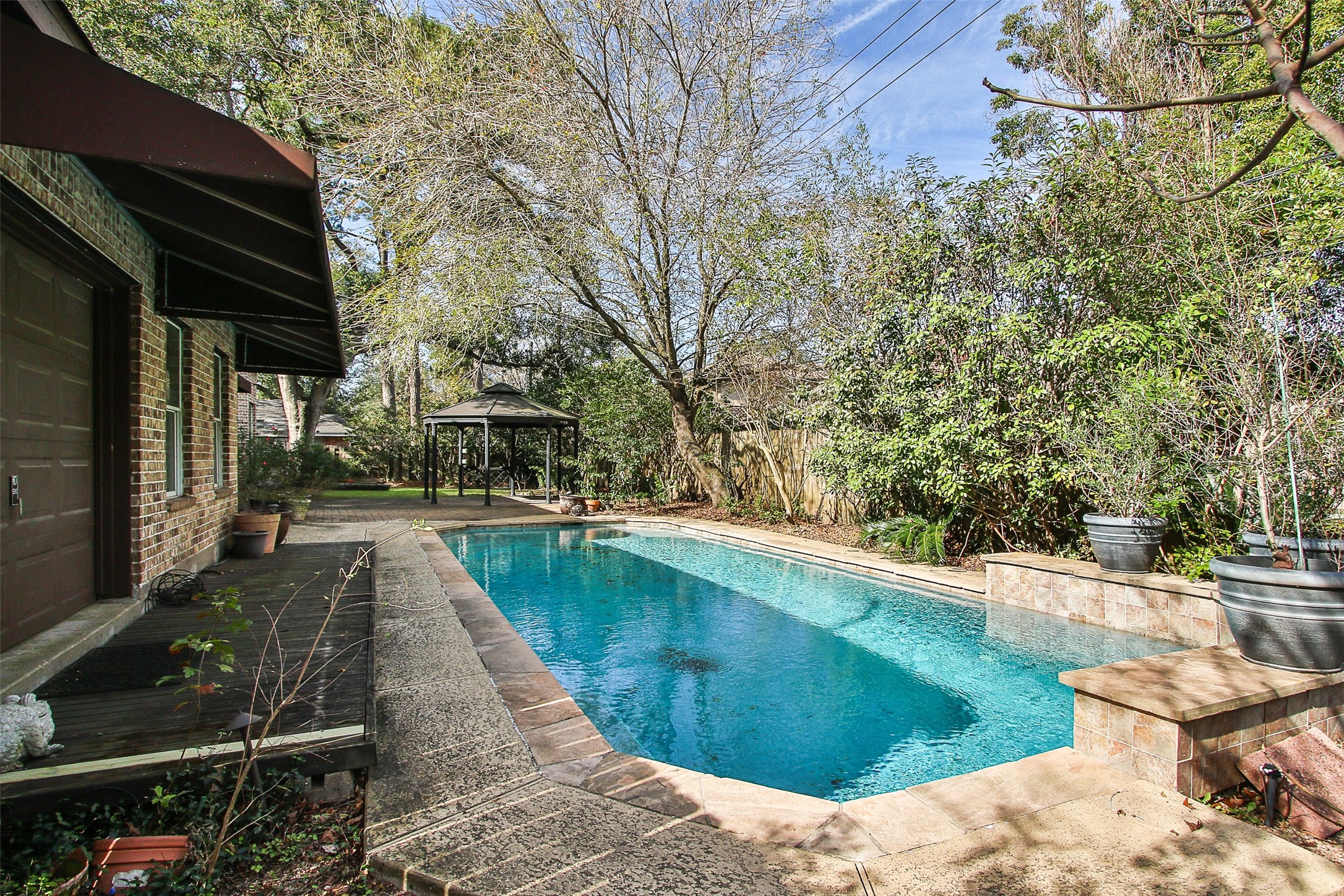 11722 Spriggs Way Houston, TX 77024 - Photo 49 of 49 a view of a backyard with sitting area