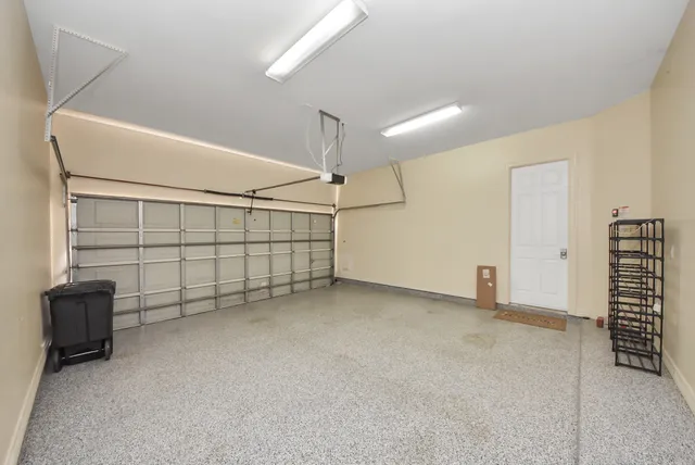 a front view of a house with a yard and fountain