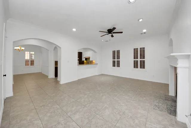 a view of a big room with windows and cabinet