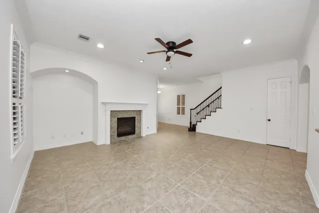 a view of an empty room with a fireplace
