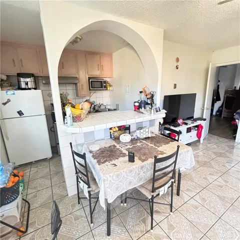 a dining room with furniture and a chandelier