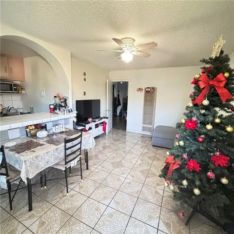 a living room with furniture and flowers