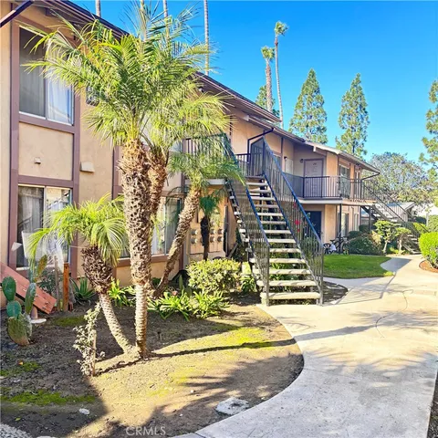 a view of a brick building next to a yard