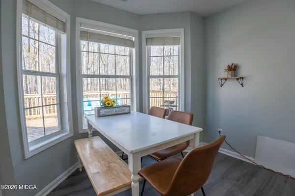 a view of a workspace with furniture and window