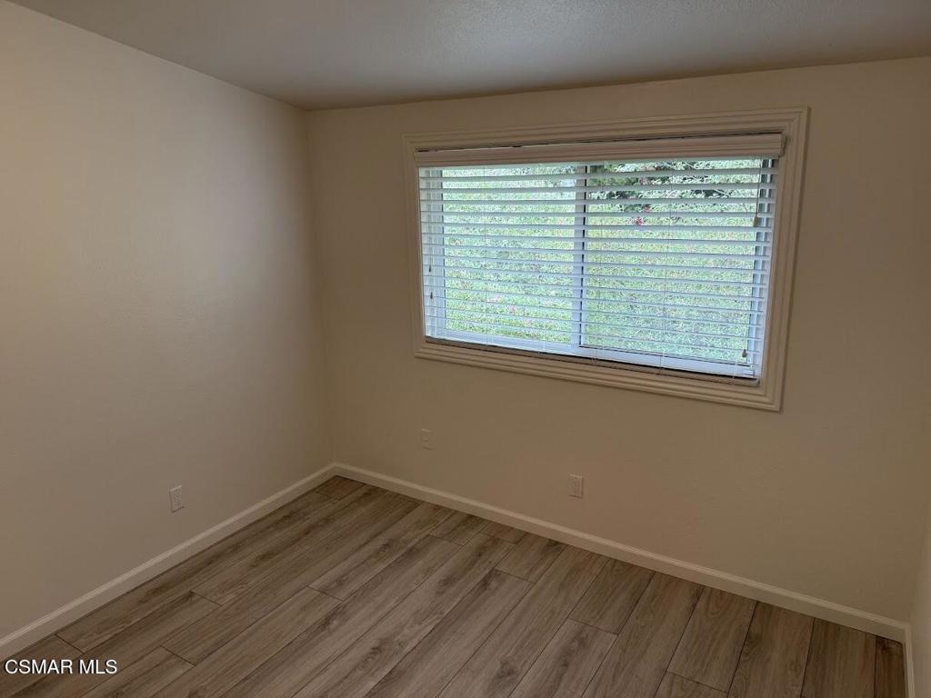 1306 Windsor Drive Thousand Oaks, CA 91360 - Photo 5 of 14 a view of a room with wooden floor and windows
