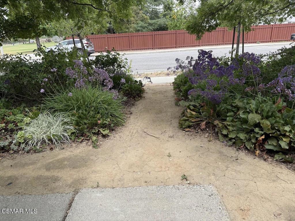 1306 Windsor Drive Thousand Oaks, CA 91360 - Photo 8 of 14 a view of a yard with plants and wooden fence