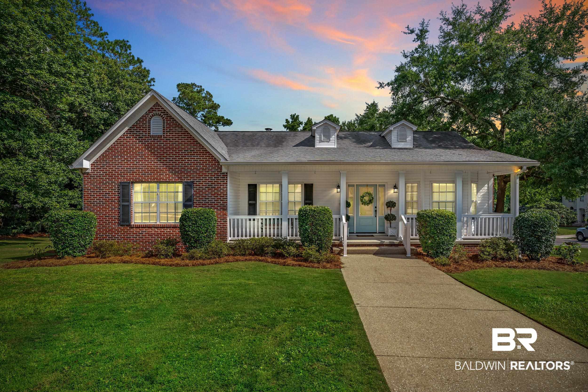 2 Navy Lane Daphne, AL 36527 - Photo 1 of 28 View of front of home featuring covered porch, a yard, and brick siding