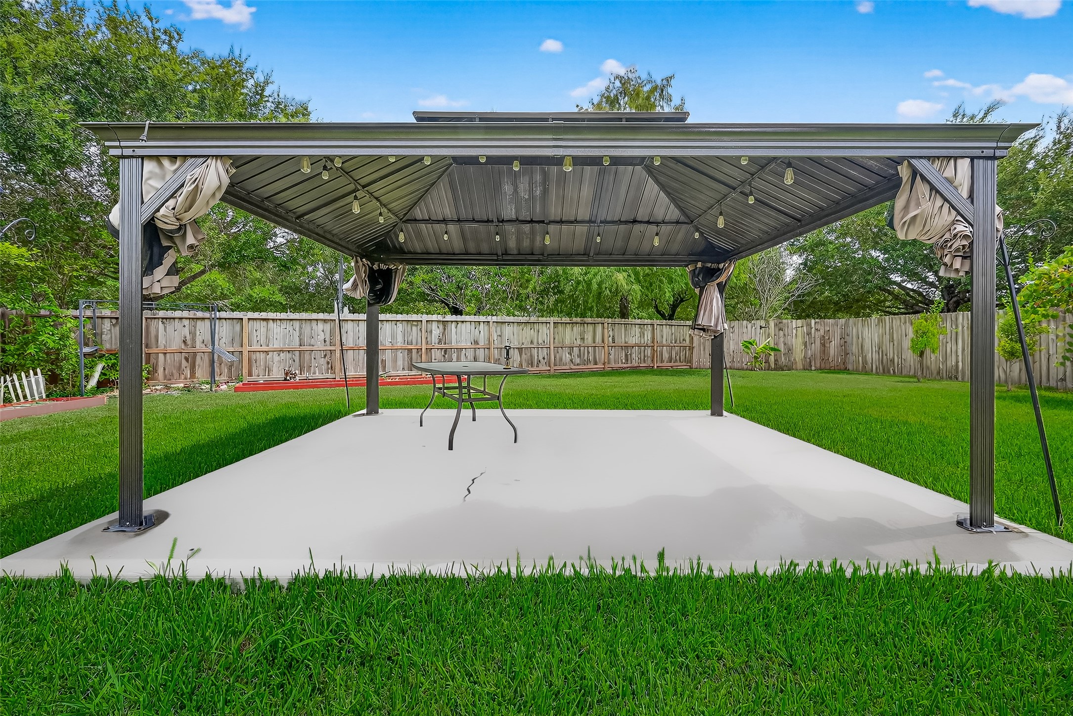 634 Hawthorne Pasture Road Rosenberg, TX 77471 - Photo 46 of 49 Step outside to a charming pergola—ideal for outdoor entertaining and family gatherings
