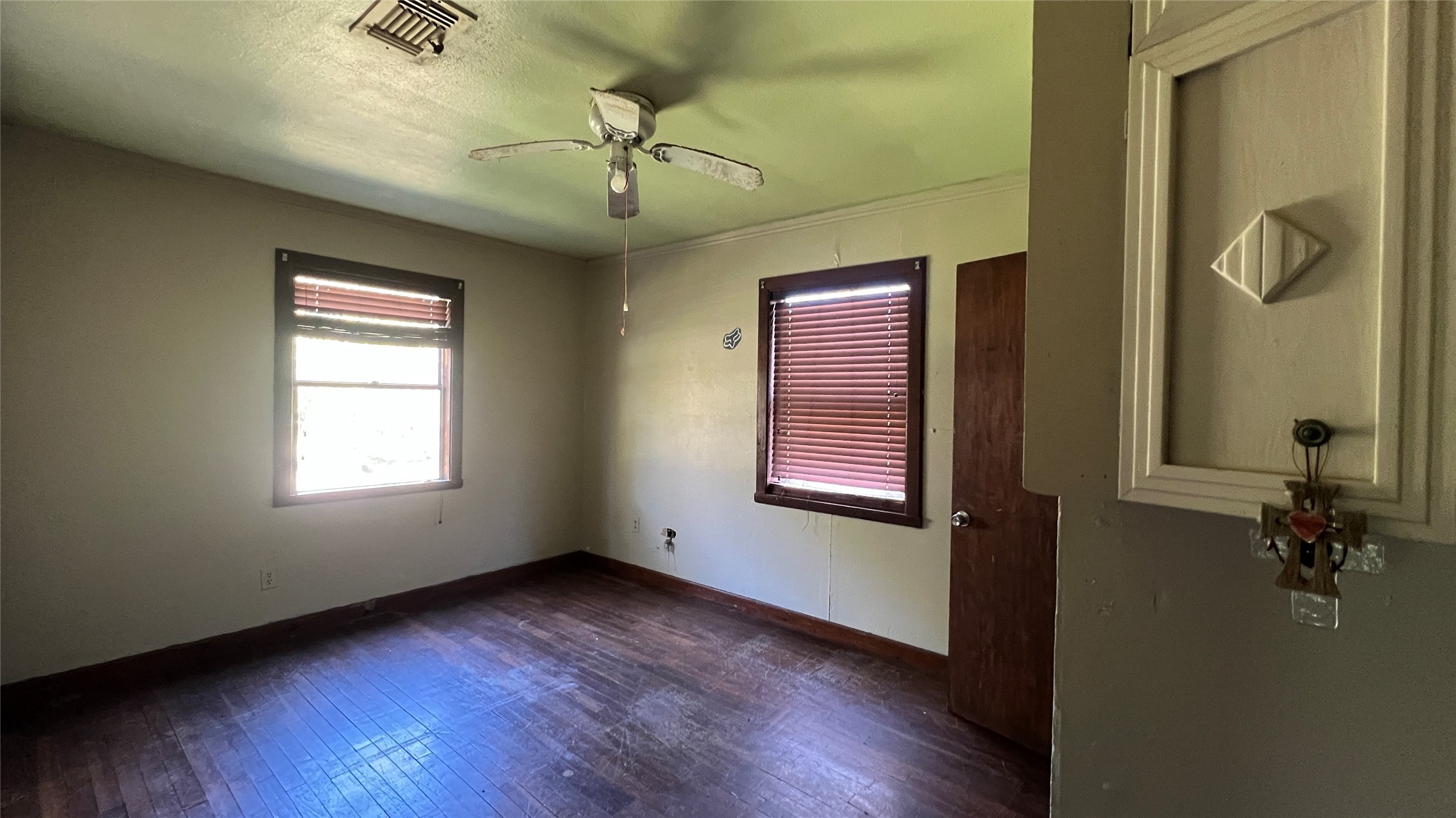10111 Oberrender Road Fairchilds, TX 77461 - Photo 13 of 20 a view of an empty room with a window and wooden floor