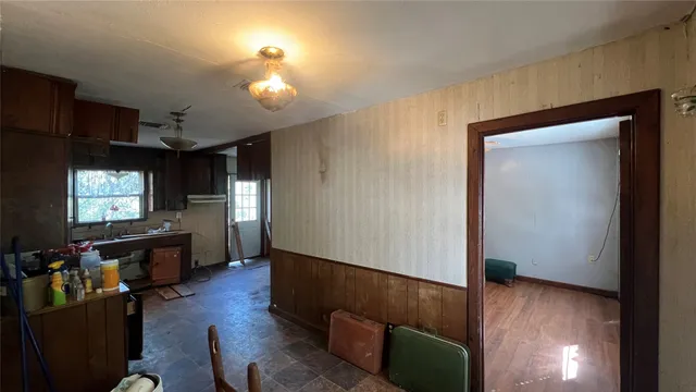 a view of a livingroom with furniture and a flat screen tv