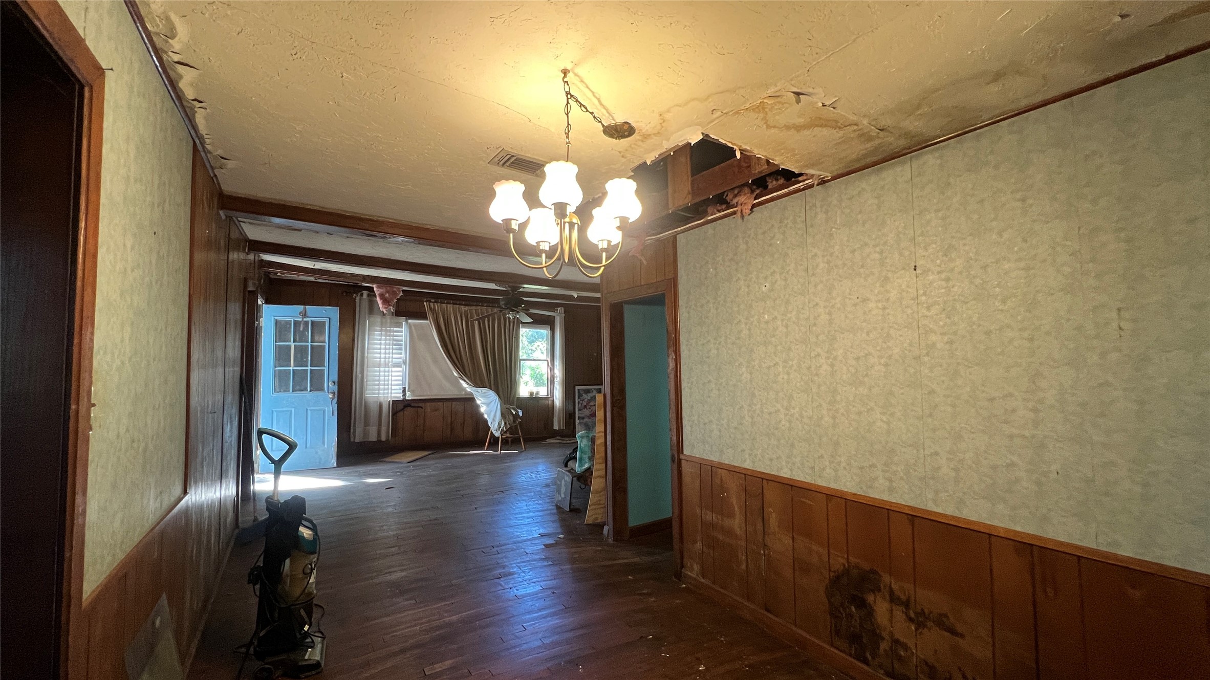 10111 Oberrender Road Fairchilds, TX 77461 - Photo 10 of 20 a view of a hallway with wooden floor and staircase